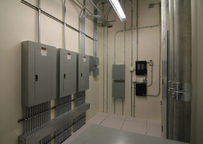 Electrical panel setup by Kazar’s Electric, featuring organized wiring systems and labels for safety.