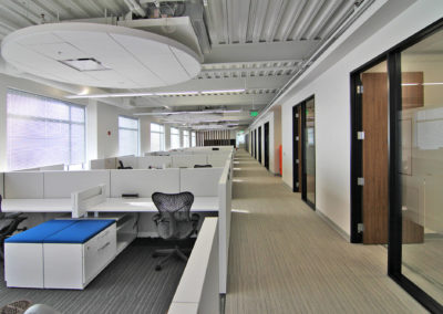 Open office layout with workstations and cubicles at Kazar’s Electric, Inc., designed for productivity and collaboration.