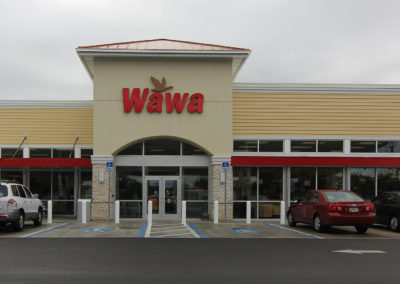 Wawa storefront with red and yellow design, accessible parking, and a welcoming community vibe.
