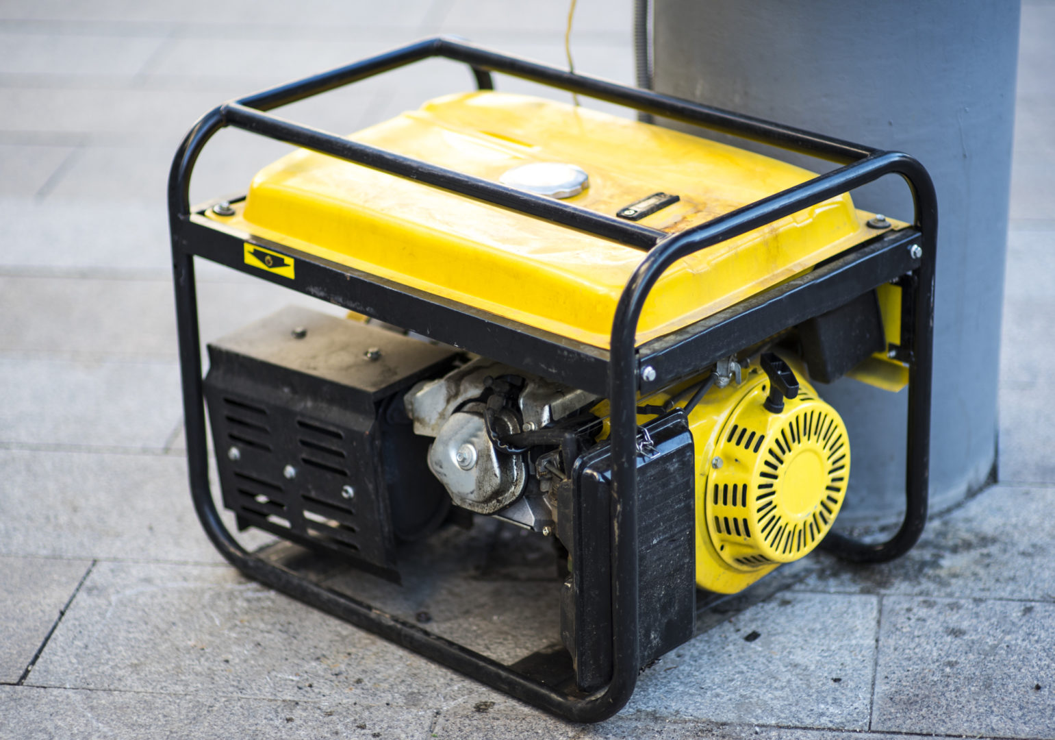 Portable generator in yellow and black, designed for safe connections by Kazar's Electric.