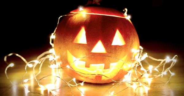 Jack-o'-lantern illuminated with fairy lights, symbolizing Halloween ambiance and potential electrical issues.