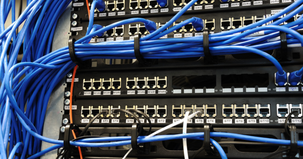 Network cables connected to a patch panel, illustrating professional electrical installation and organization for optimal system performance.