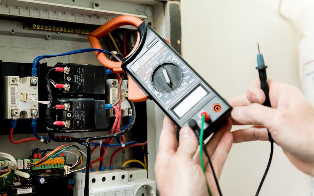 Multimeter used for electrical inspection at Kazar's Electric, showcasing circuit breakers and colorful wires.