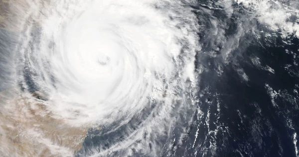 Hurricane satellite image showing intense storm system, emphasizing the importance of hurricane season generators for power outage preparedness.