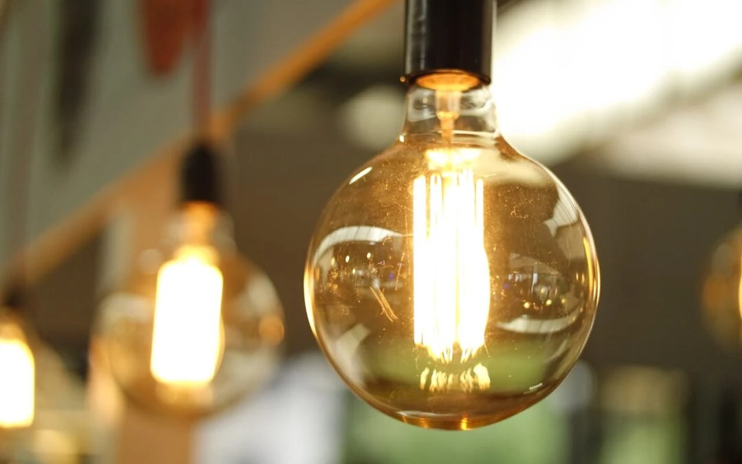 Vintage light bulbs with warm glow, representing Kazar's Electric approach to diagnosing flickering lights.